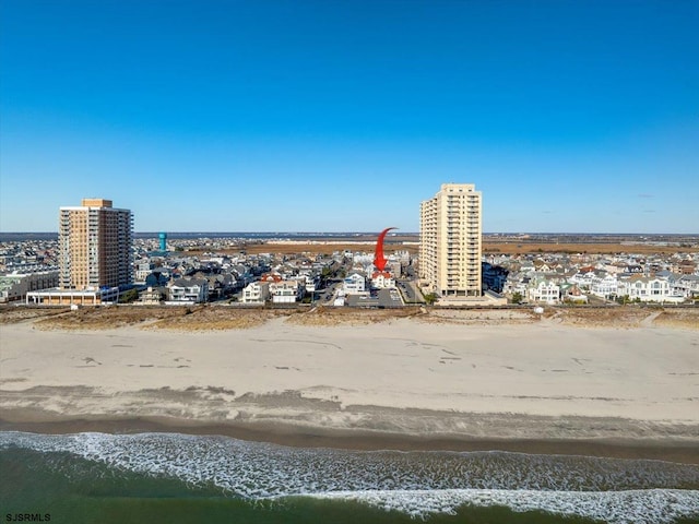 drone / aerial view with a view of the beach and a water view