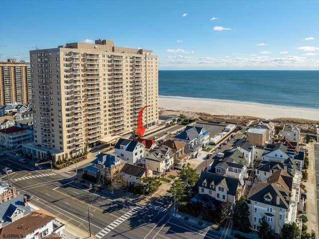 bird's eye view with a water view and a view of the beach