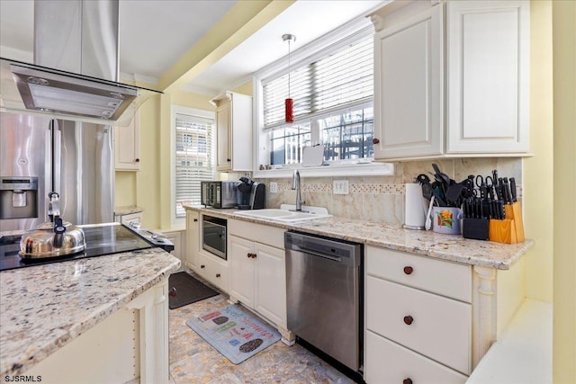 kitchen with tasteful backsplash, white cabinetry, sink, and stainless steel appliances