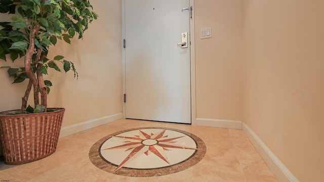 foyer featuring light tile patterned flooring