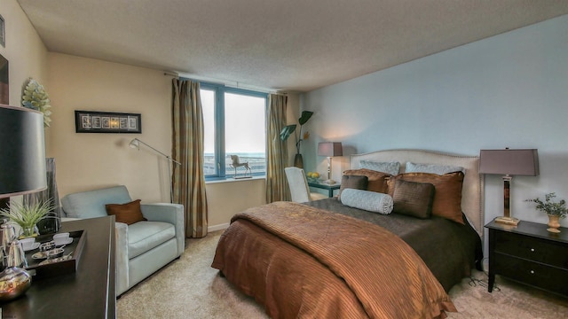 carpeted bedroom featuring a textured ceiling