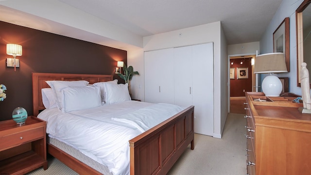 carpeted bedroom featuring a closet