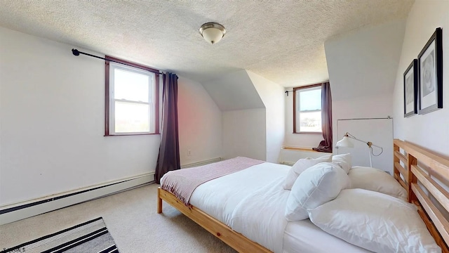 carpeted bedroom with vaulted ceiling, multiple windows, a textured ceiling, and a baseboard heating unit