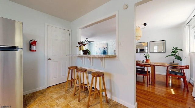 corridor with light hardwood / wood-style floors