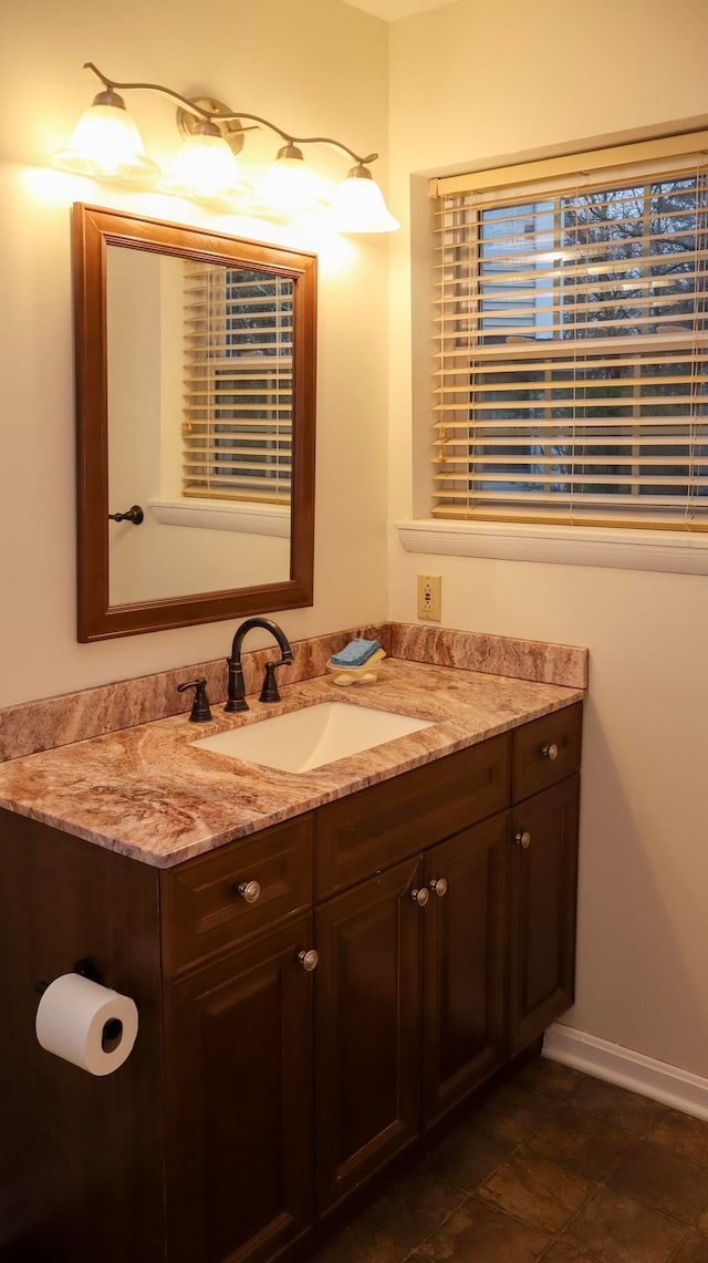 bathroom featuring tile patterned flooring and vanity