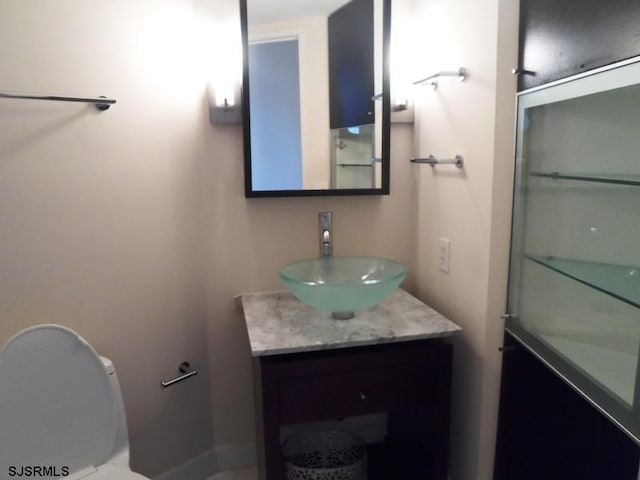 bathroom with vanity and toilet