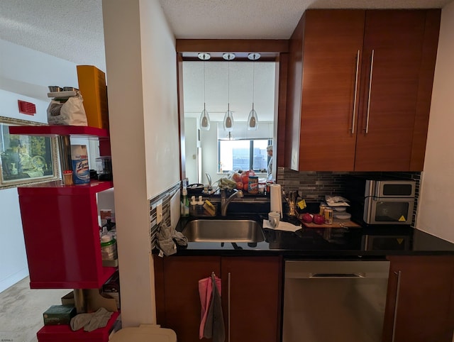 kitchen with dishwasher, a textured ceiling, and sink