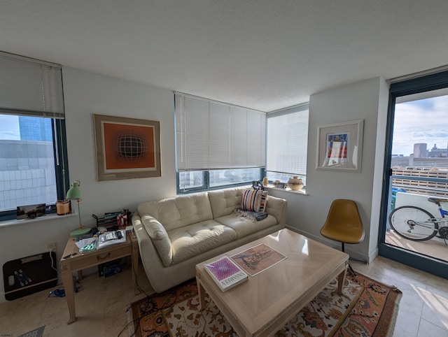 tiled living room with a textured ceiling