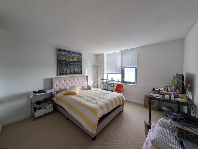 bedroom with carpet flooring and a textured ceiling