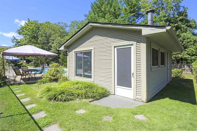 view of outdoor structure with a lawn