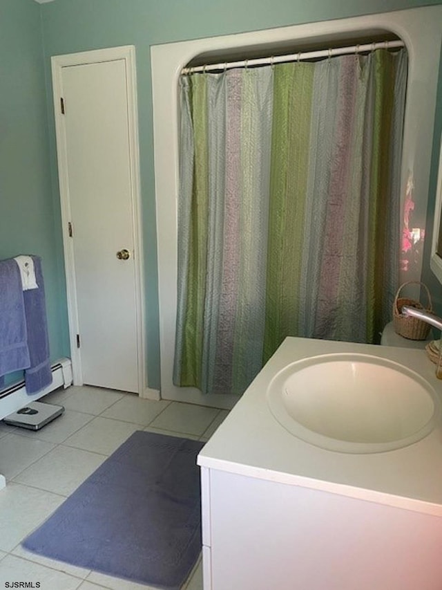 bathroom with tile patterned flooring and vanity