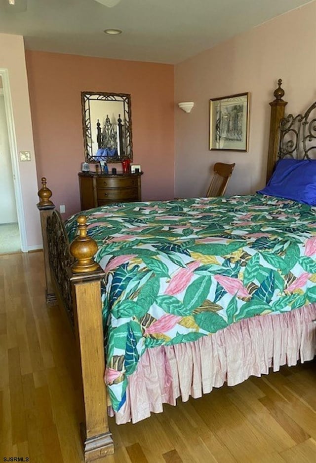 bedroom featuring hardwood / wood-style floors