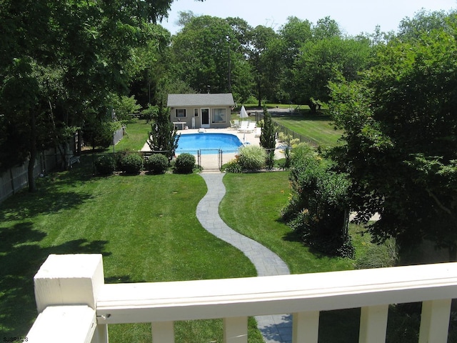 view of pool featuring an outdoor structure and a yard