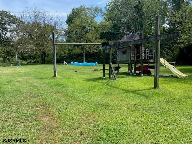 view of play area featuring a lawn