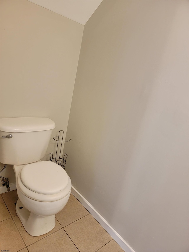 bathroom with tile patterned floors and toilet