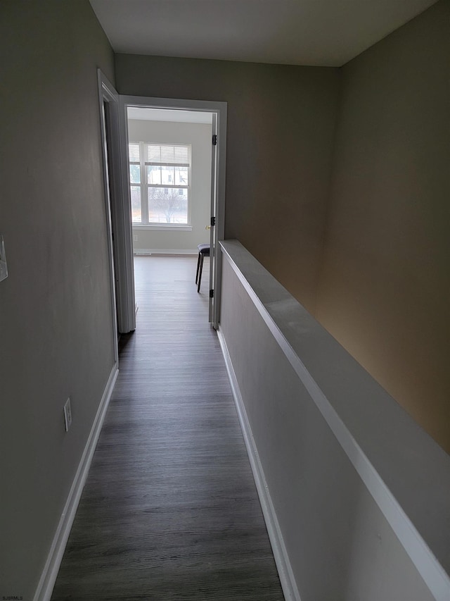 corridor with dark wood-type flooring