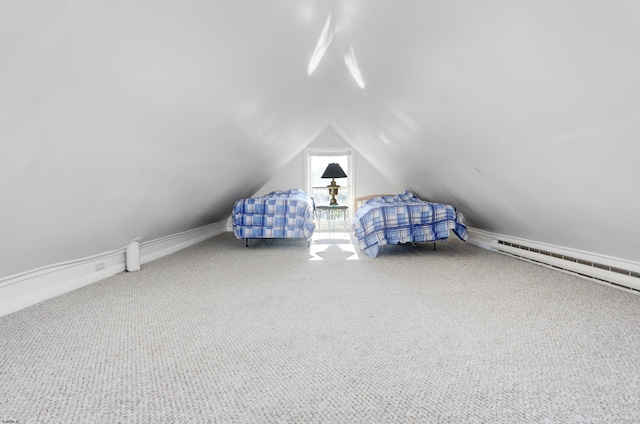 unfurnished bedroom featuring a baseboard heating unit, carpet floors, and lofted ceiling