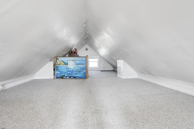 bonus room featuring carpet and lofted ceiling