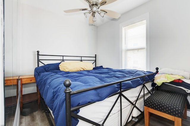 bedroom with hardwood / wood-style flooring and ceiling fan