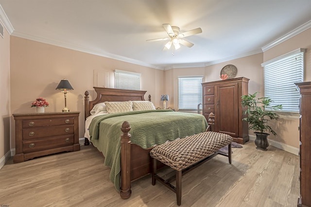 bedroom featuring multiple windows, ceiling fan, light hardwood / wood-style flooring, and crown molding