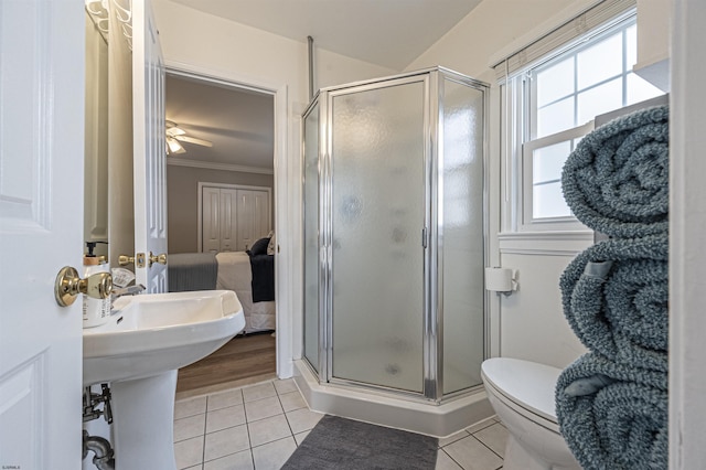 bathroom with crown molding, tile patterned flooring, and a shower with shower door