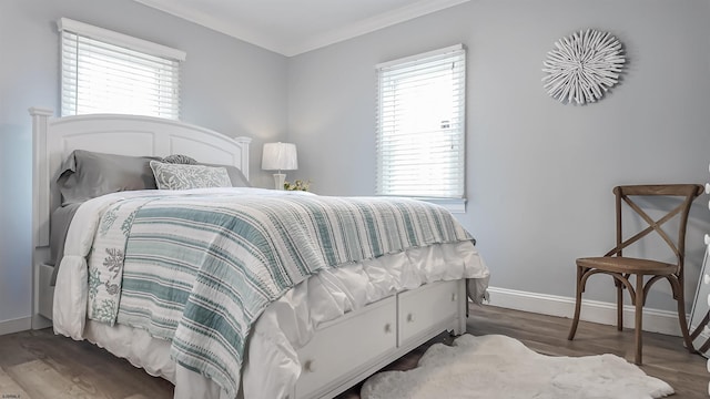 bedroom featuring dark hardwood / wood-style flooring and ornamental molding