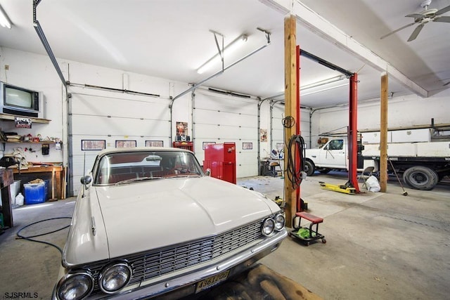 garage with a workshop area and ceiling fan