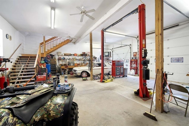 garage featuring a workshop area and ceiling fan