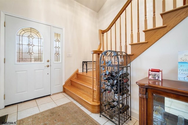 foyer entrance with light tile patterned flooring