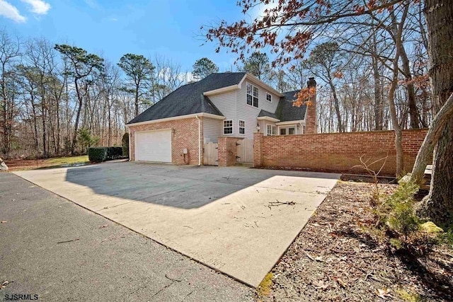 view of side of property featuring a garage