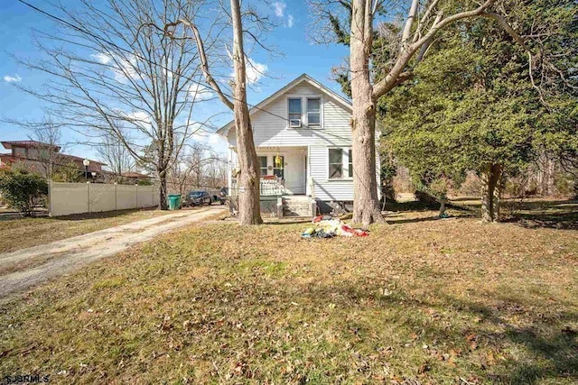 view of front of property featuring a porch and a front lawn