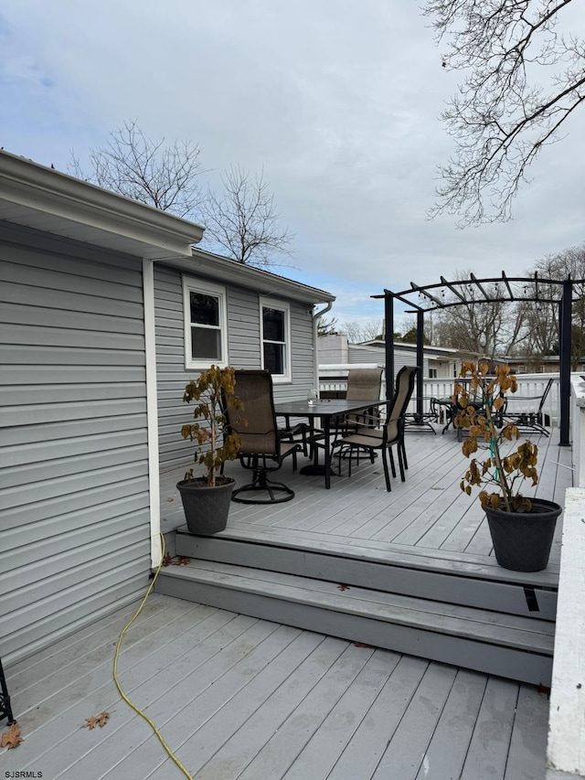 wooden deck with a pergola