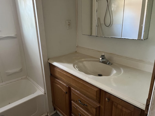 bathroom with vanity and bathing tub / shower combination