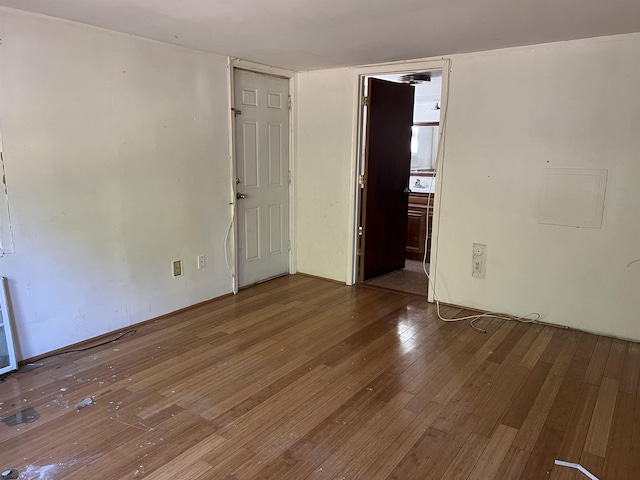 unfurnished room featuring hardwood / wood-style floors