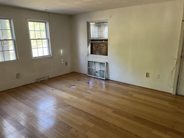 spare room featuring light wood-type flooring