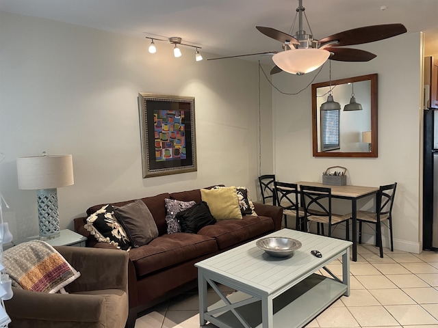 living room with ceiling fan and light tile patterned floors