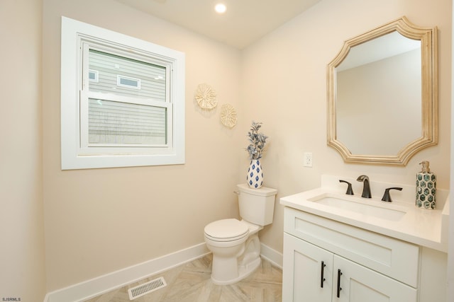 bathroom with vanity and toilet