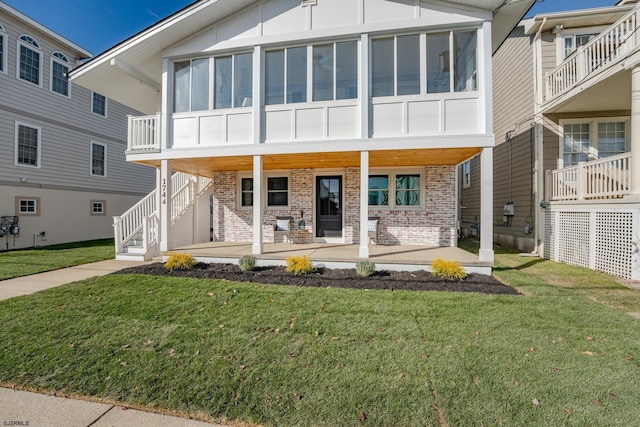 view of front facade with a patio area and a front lawn