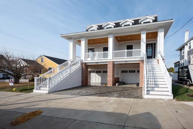 view of front facade with covered porch and a garage