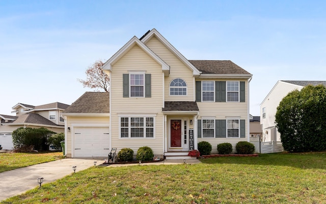 view of front facade with a front yard and a garage