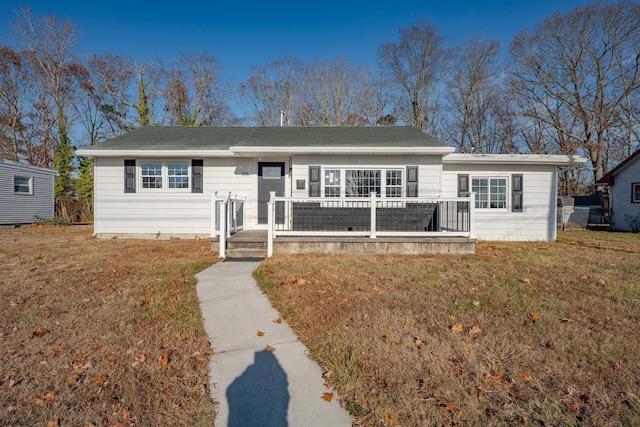 ranch-style house with a front lawn