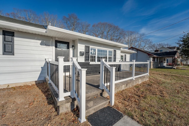 property entrance with a yard