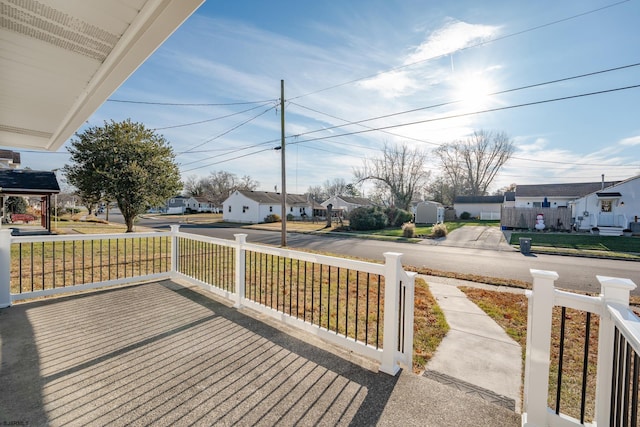 wooden terrace featuring covered porch