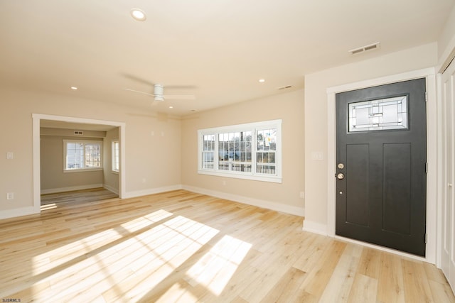 entrance foyer with ceiling fan and light wood-type flooring