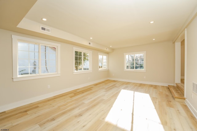 spare room featuring light hardwood / wood-style floors