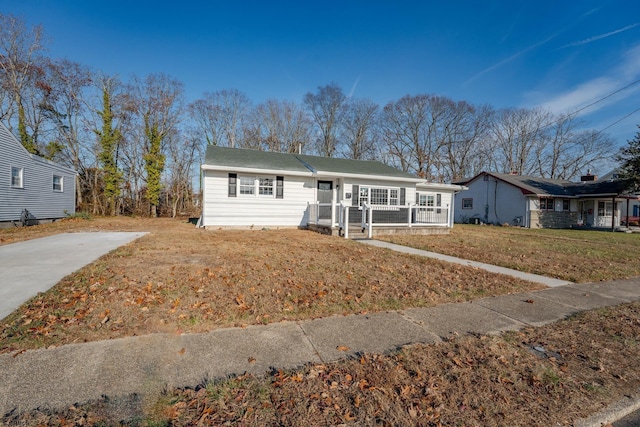 ranch-style house with a front yard