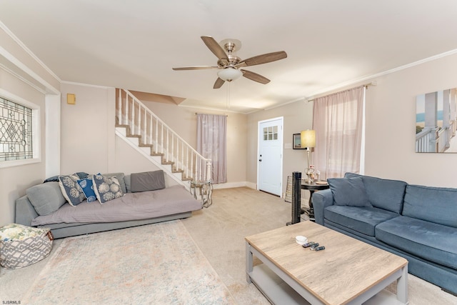 living room with ceiling fan, light colored carpet, and crown molding