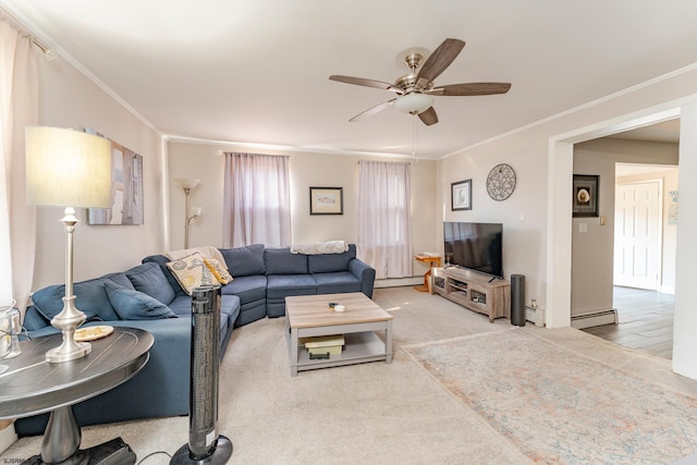 carpeted living room with ceiling fan, crown molding, and a baseboard heating unit