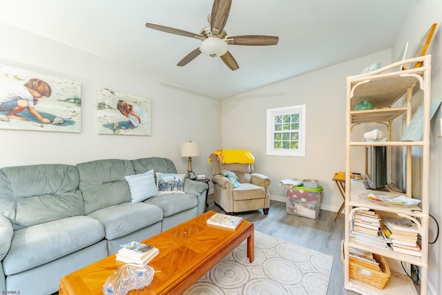 living room with ceiling fan and light wood-type flooring