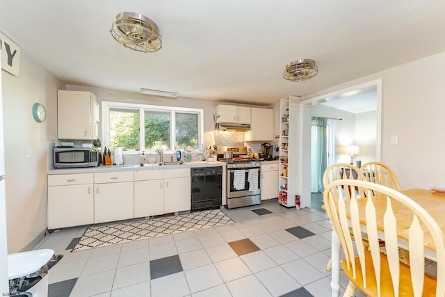 kitchen featuring decorative backsplash, stainless steel appliances, sink, light tile patterned floors, and white cabinets